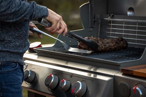 Make sure you are wearing heat-resistant gloves when operating your grill. Never grill inside your garage or under an overhang, no matter the weather—snow, rain, sleet or wind. Grilling safely is always the best policy, so be sure your grill is at least two feet away from all combustible materials and in a well-ventilated area.